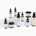 a group of bottles of different types of skin care products