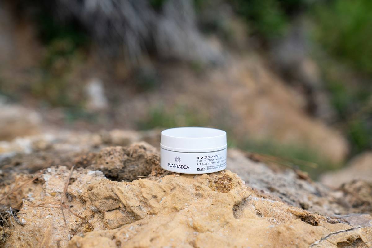 a white container sitting on top of a rock