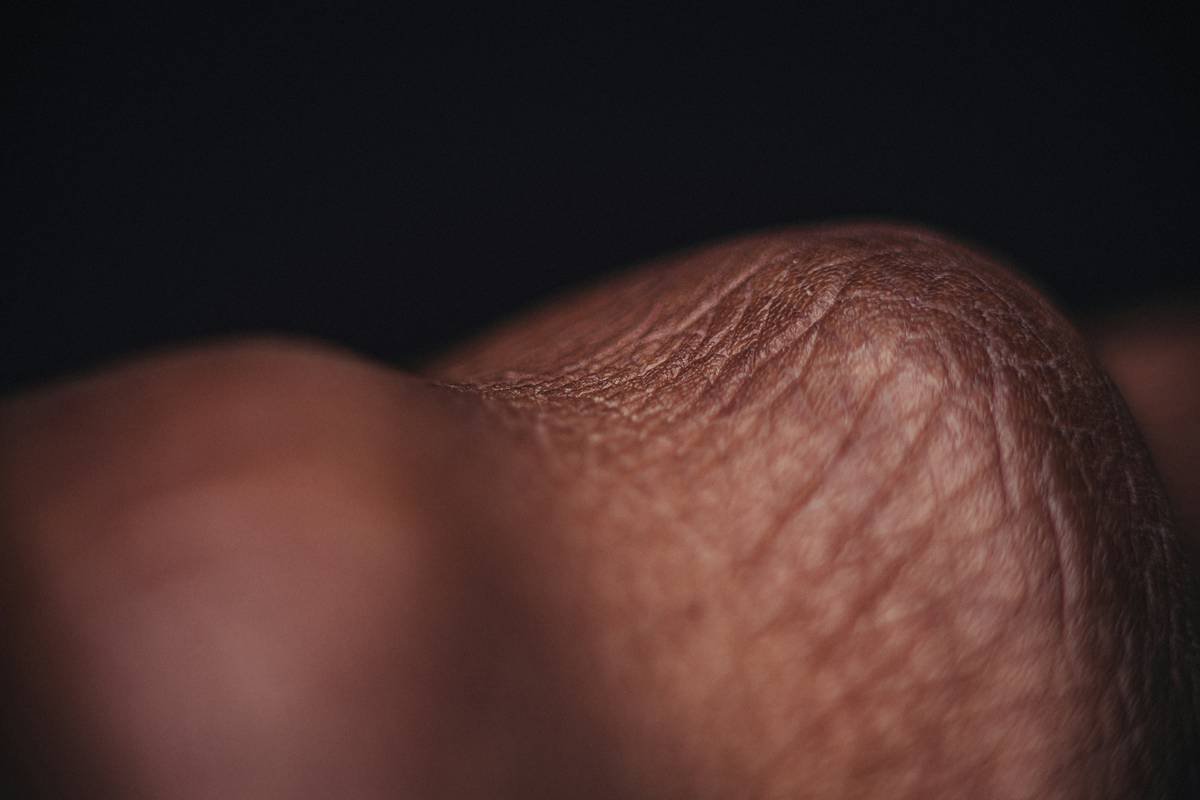 Close-up of jar containing rich moisturizing balm with shea
