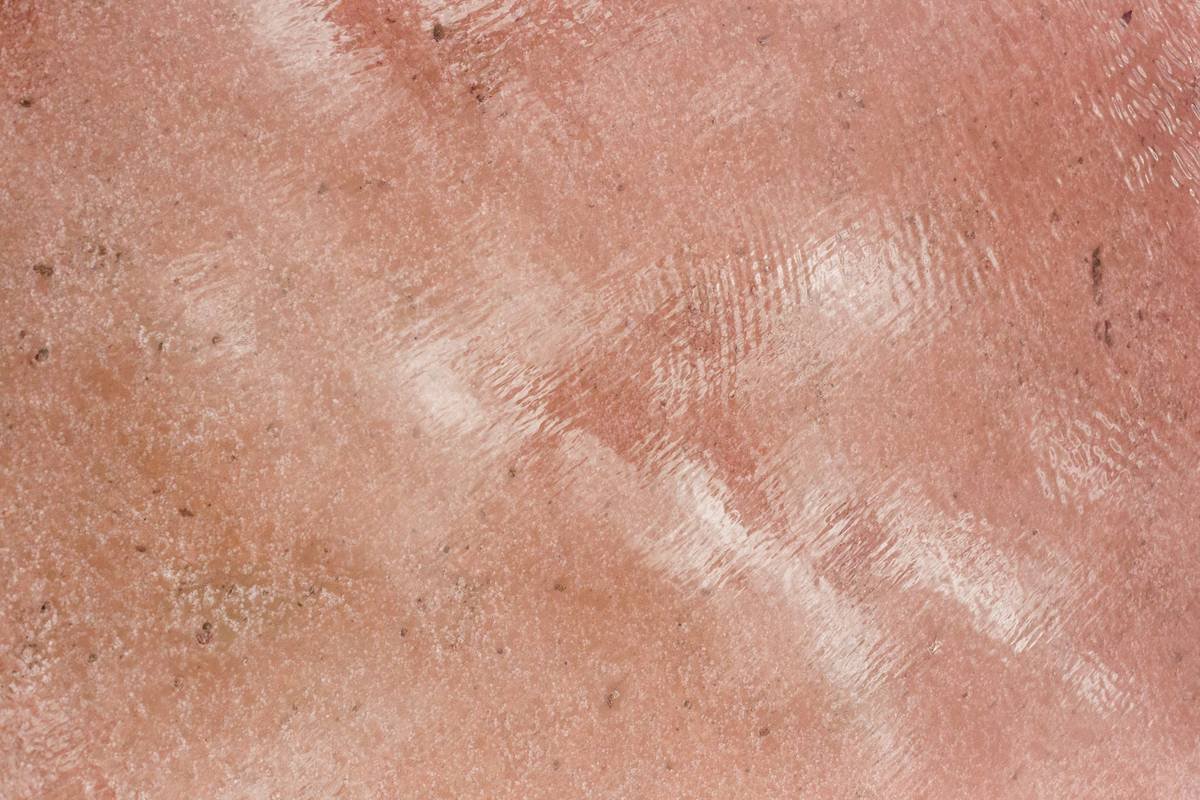 Close-up of protective balm with antioxidants jar showing rich texture and natural ingredients